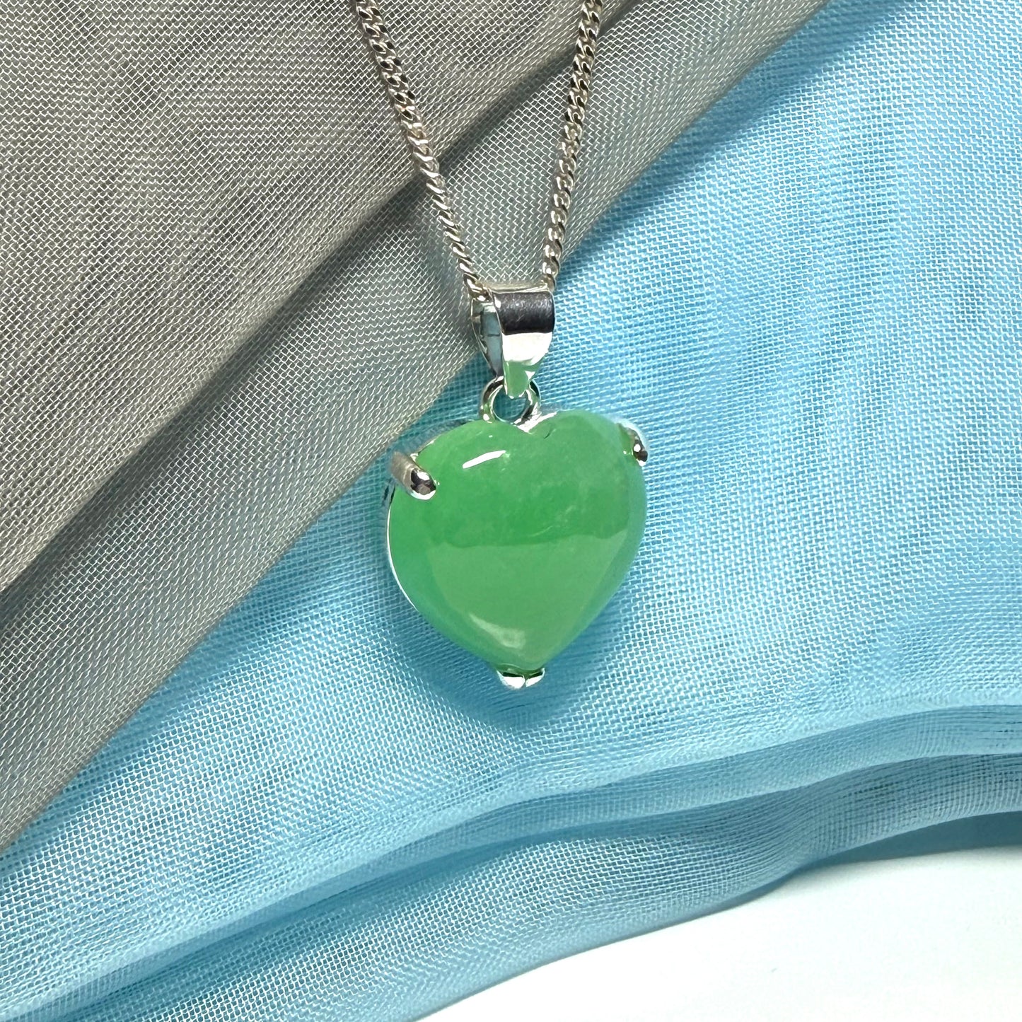 A real green jade necklace heart shaped sterling silver with chain