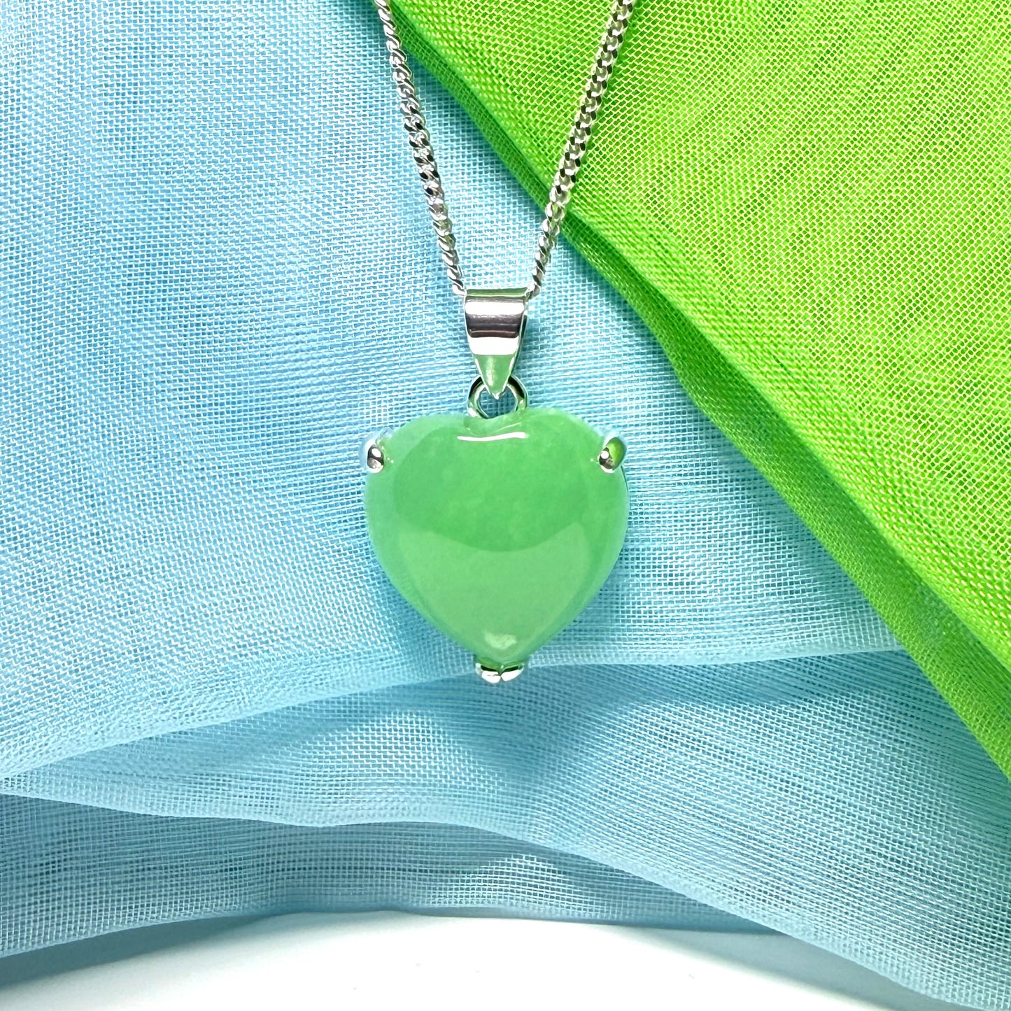 A stunning real green jade necklace heart shaped sterling silver with chain included as well