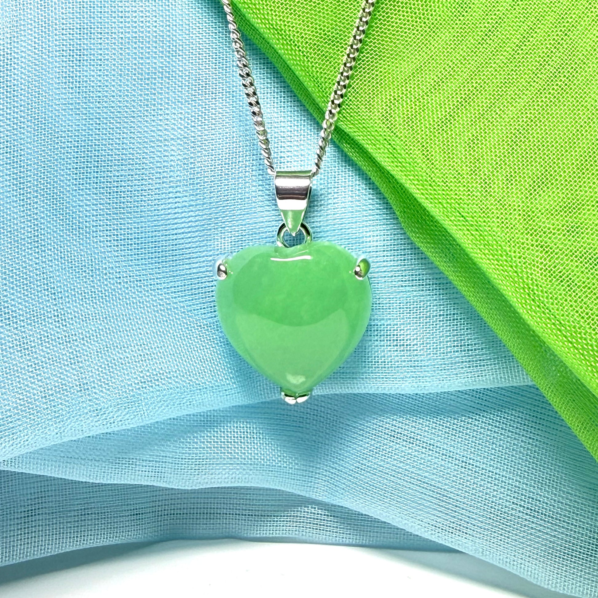 A stunning real green jade necklace heart shaped sterling silver with chain included as well