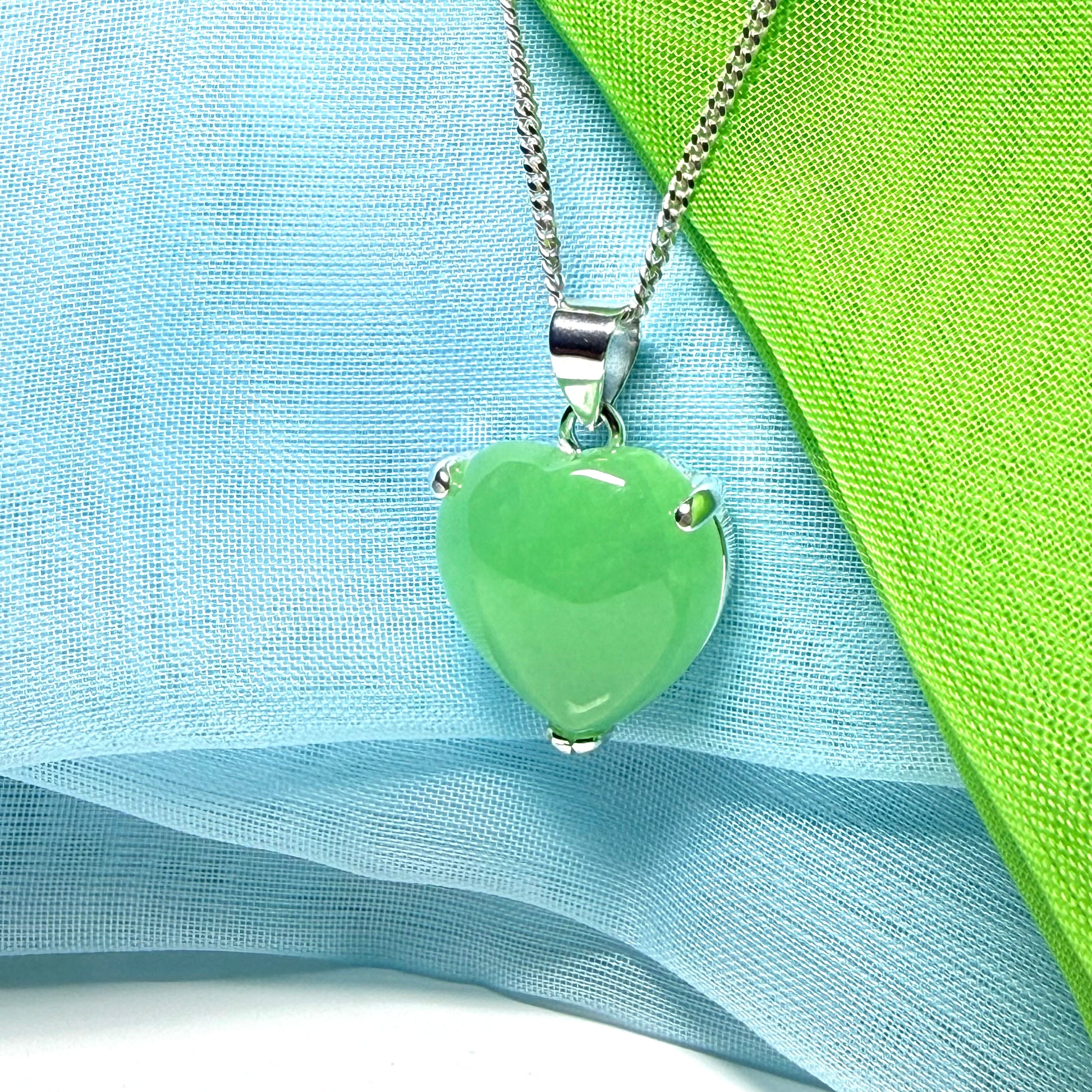 A stunning real green jade necklace heart shaped sterling silver with chain included as well