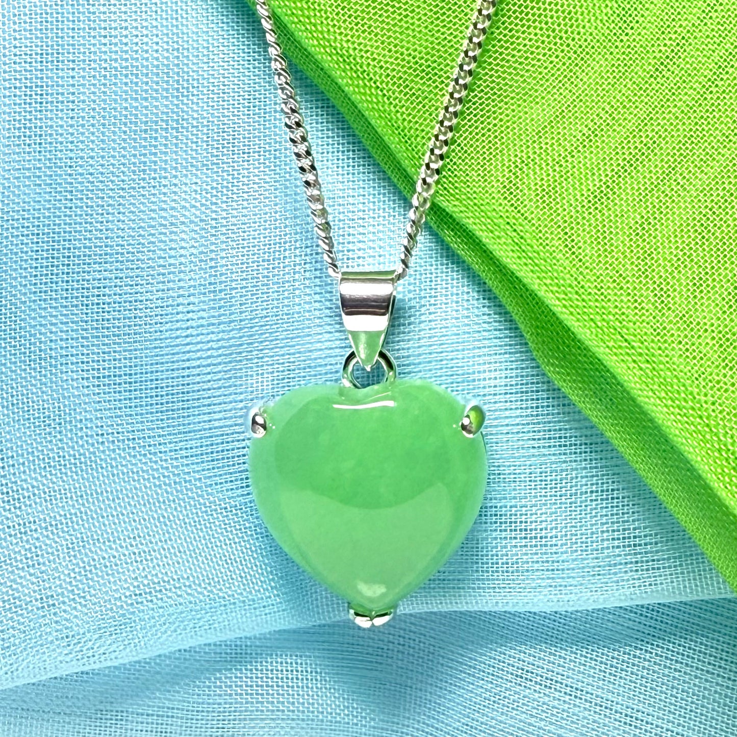 A stunning real green jade necklace heart shaped sterling silver with chain included as well