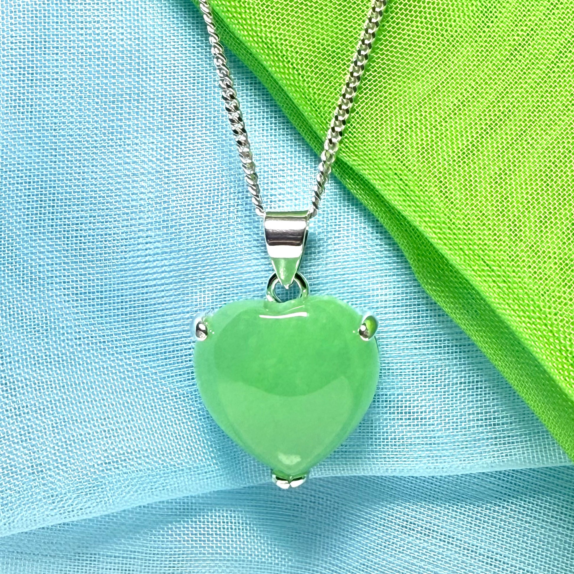A stunning real green jade necklace heart shaped sterling silver with chain included as well