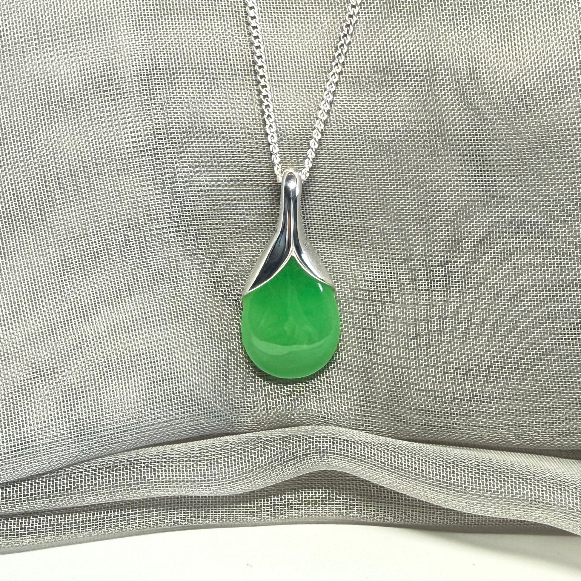 A stunning real green jade necklace in a teardrop, a timeless designed pendant