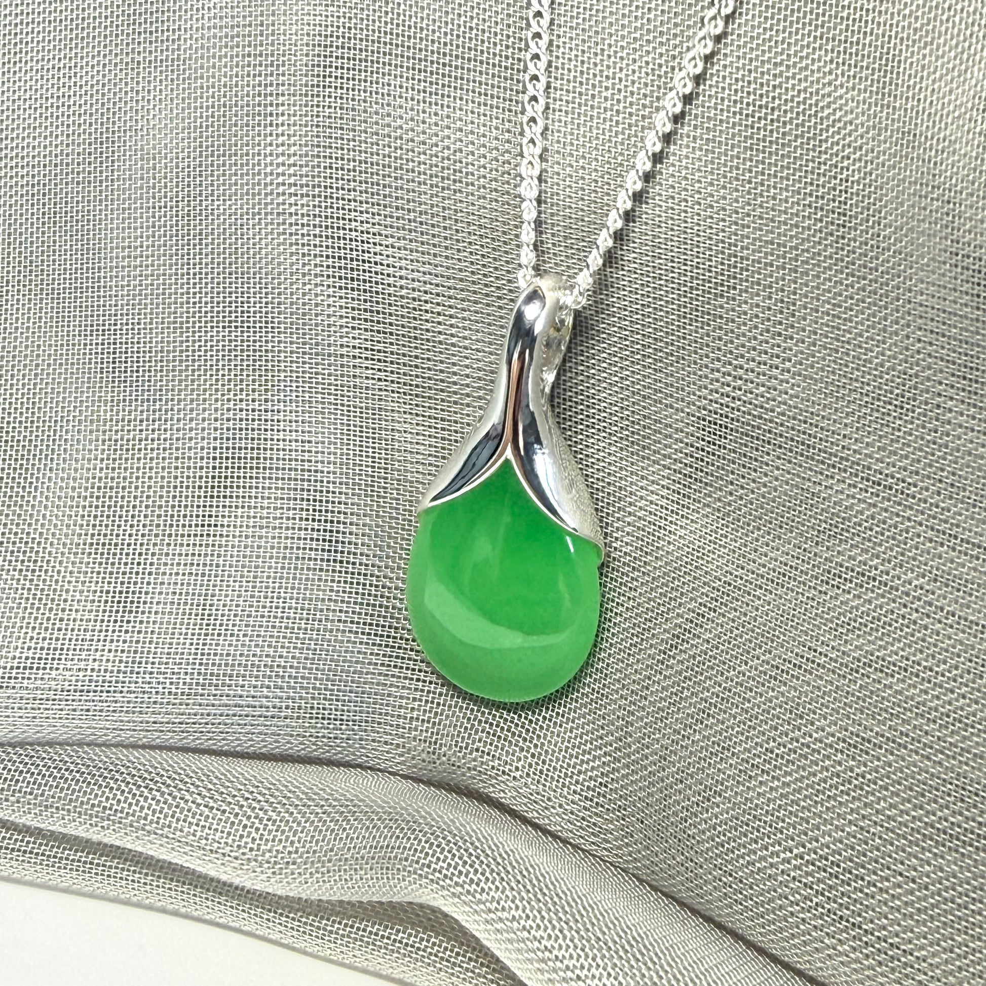 A stunning real green jade necklace in a teardrop, a timeless designed pendant