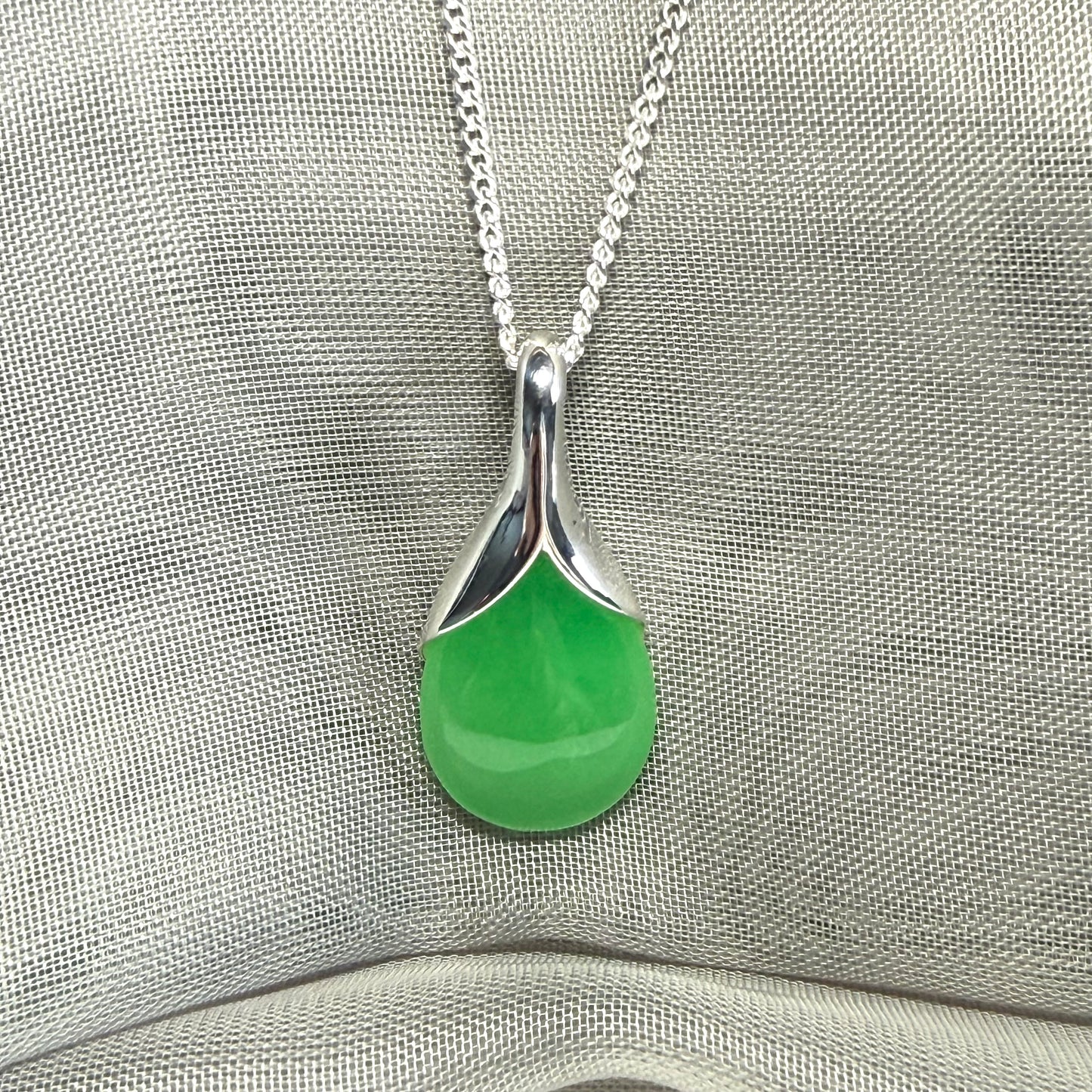 A stunning real green jade necklace in a teardrop, a timeless designed pendant