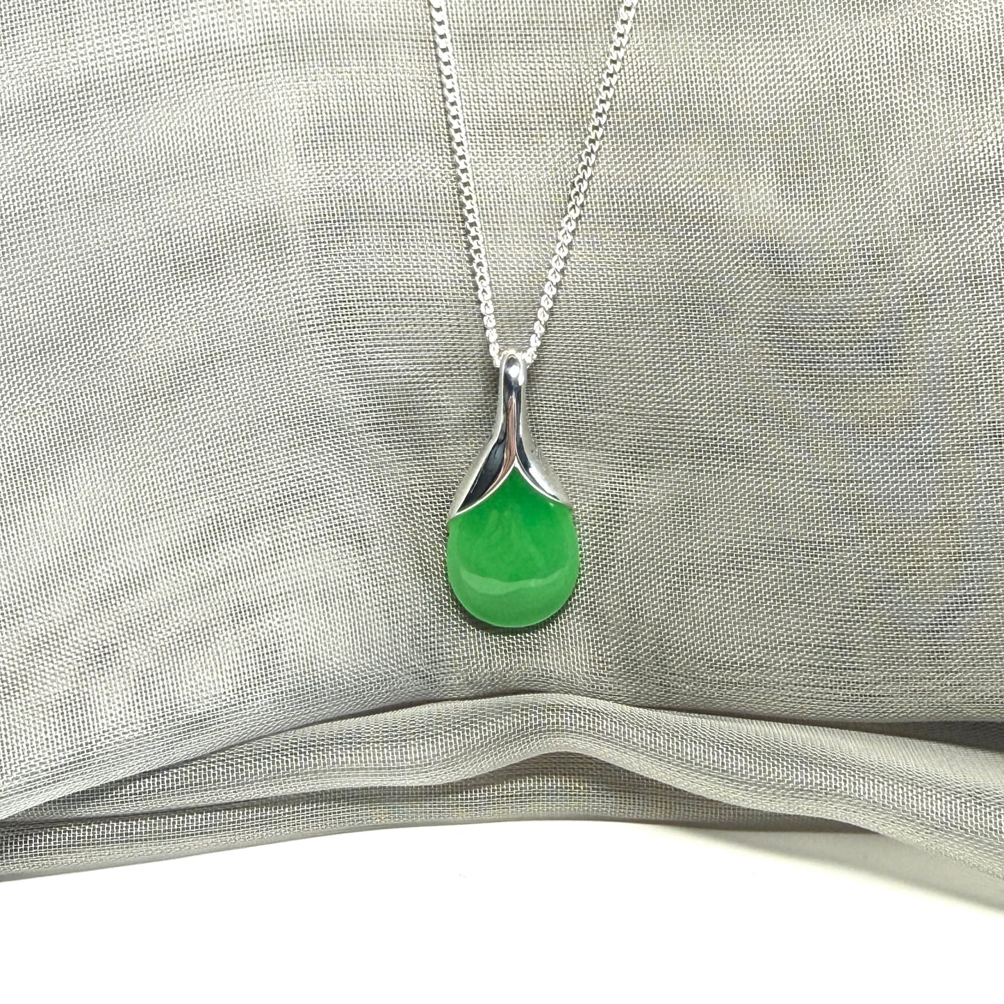 A stunning real green jade necklace in a teardrop, a timeless designed pendant
