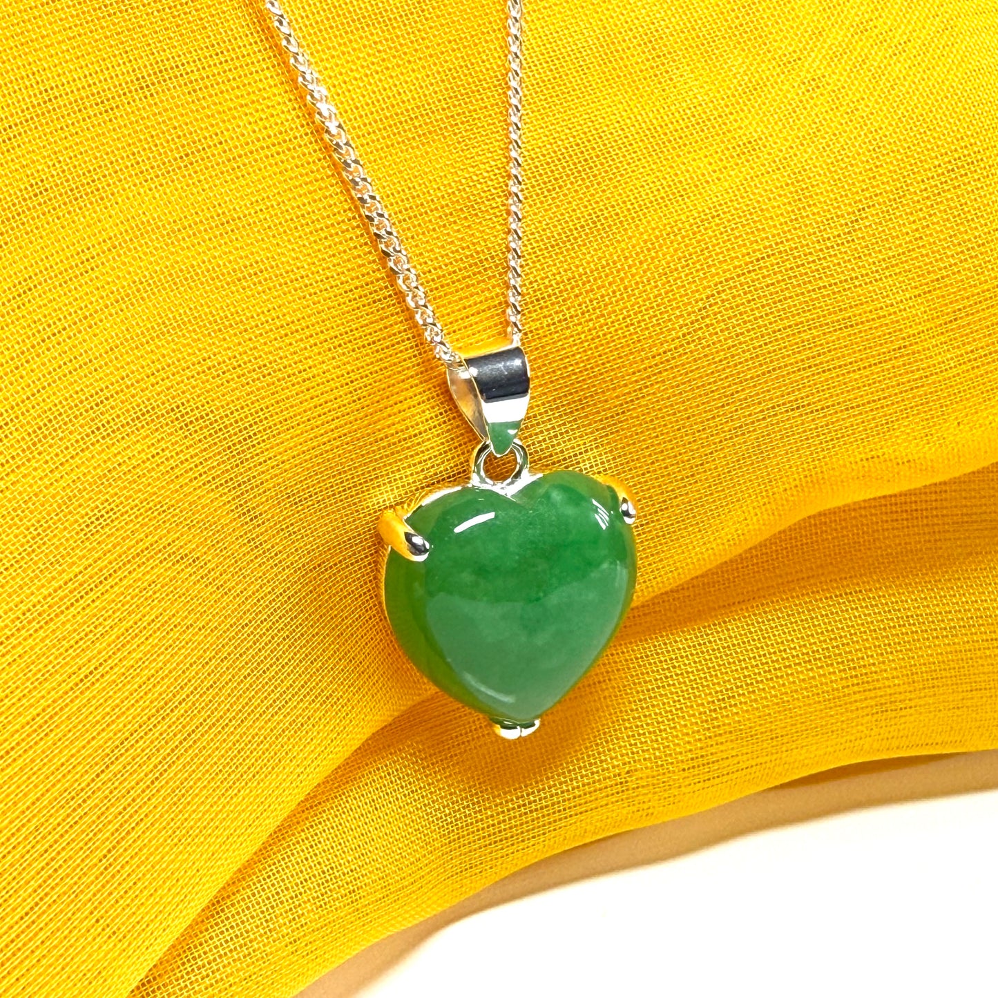 A stunning real green jade pendant heart shaped sterling silver, a traditional design necklace