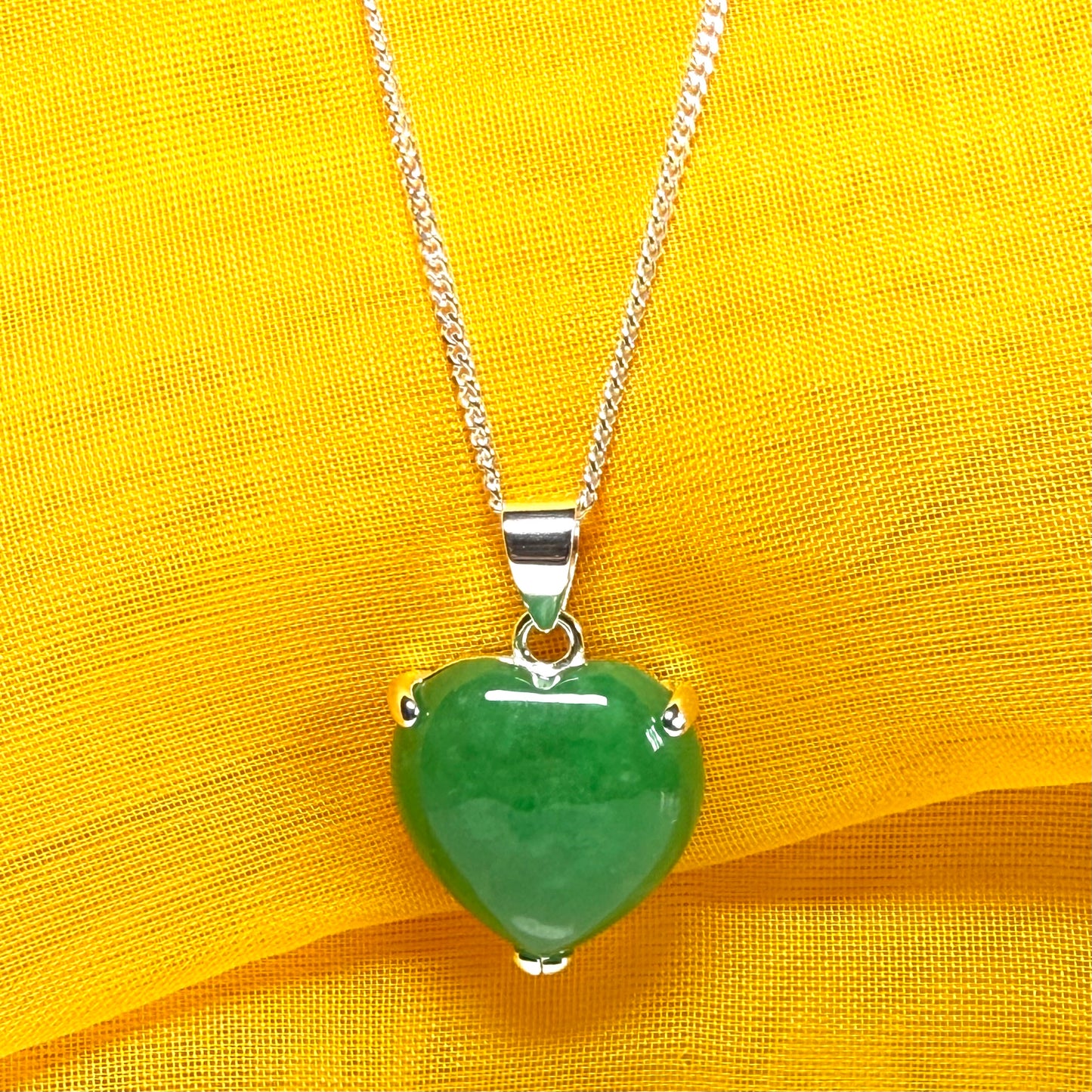 A stunning real green jade pendant heart shaped sterling silver, a traditional design necklace