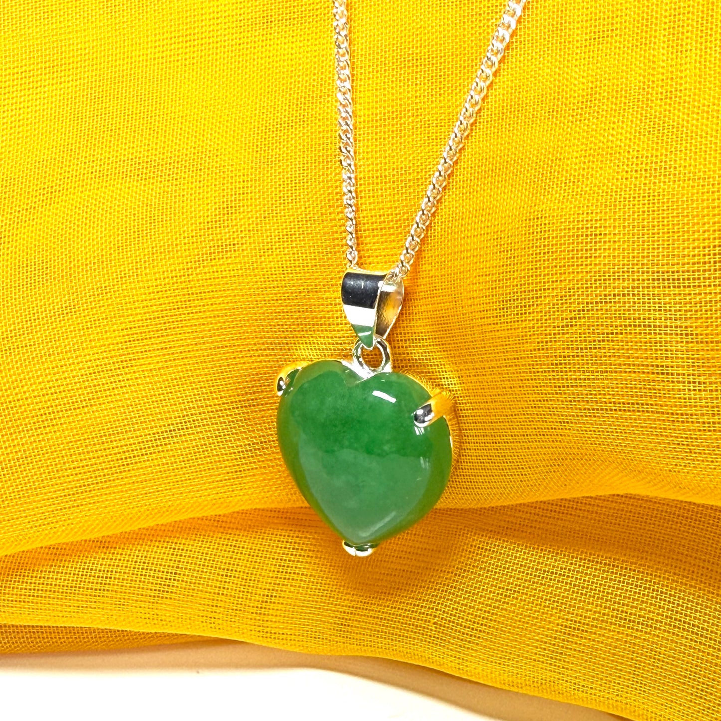 A stunning real green jade pendant heart shaped sterling silver, a traditional design necklace with chain