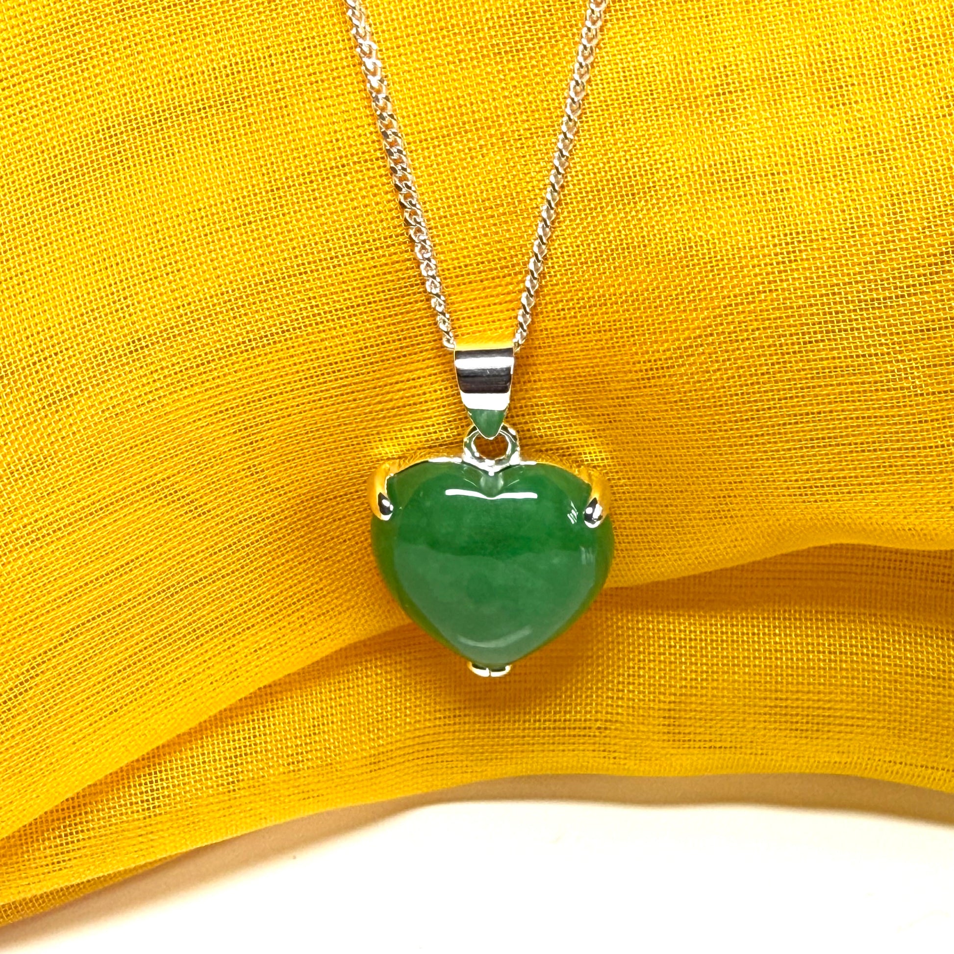 A stunning real green jade pendant heart shaped sterling silver, a traditional design necklace