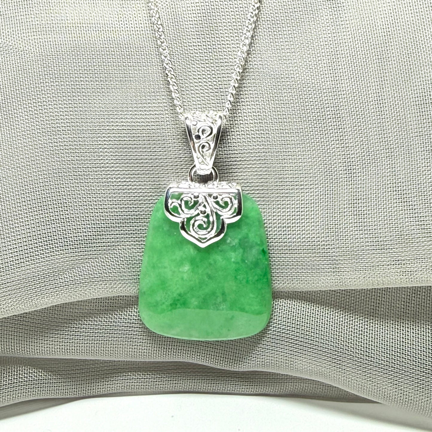A stunning real jade necklace green sterling silver large cushion shaped pendant