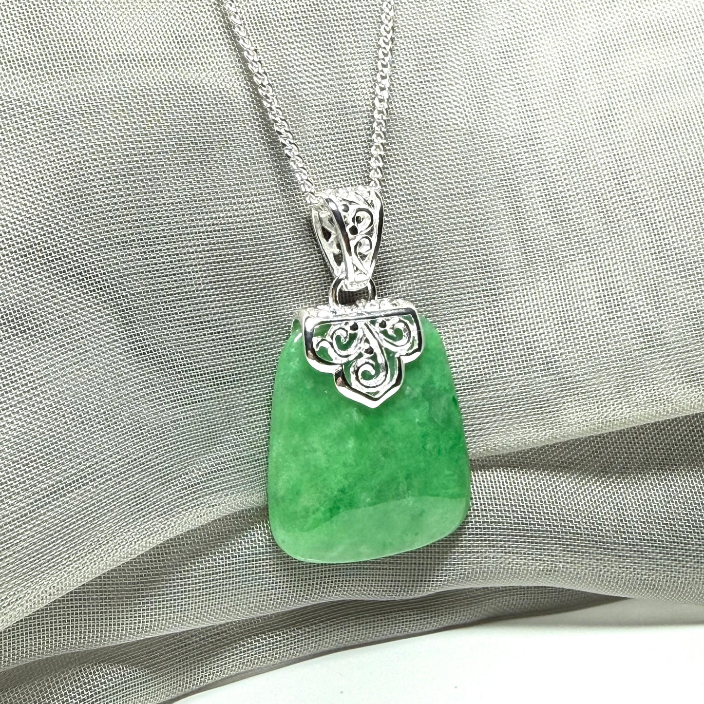 A stunning real jade necklace green sterling silver large cushion shaped pendant