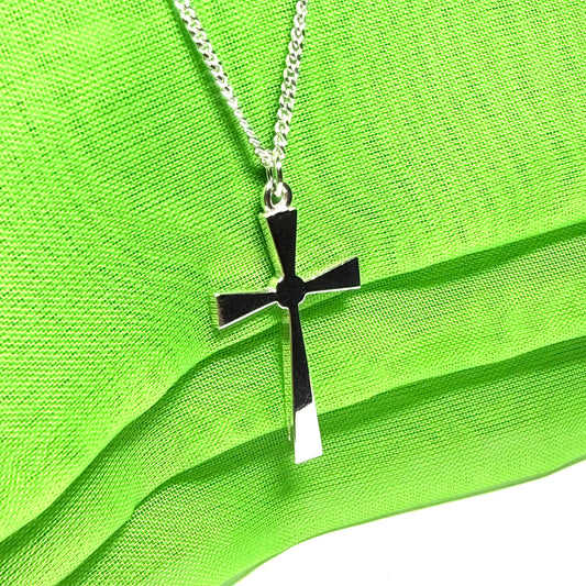 A thick solid sterling silver cross necklace fancy shaped pendant with a chain