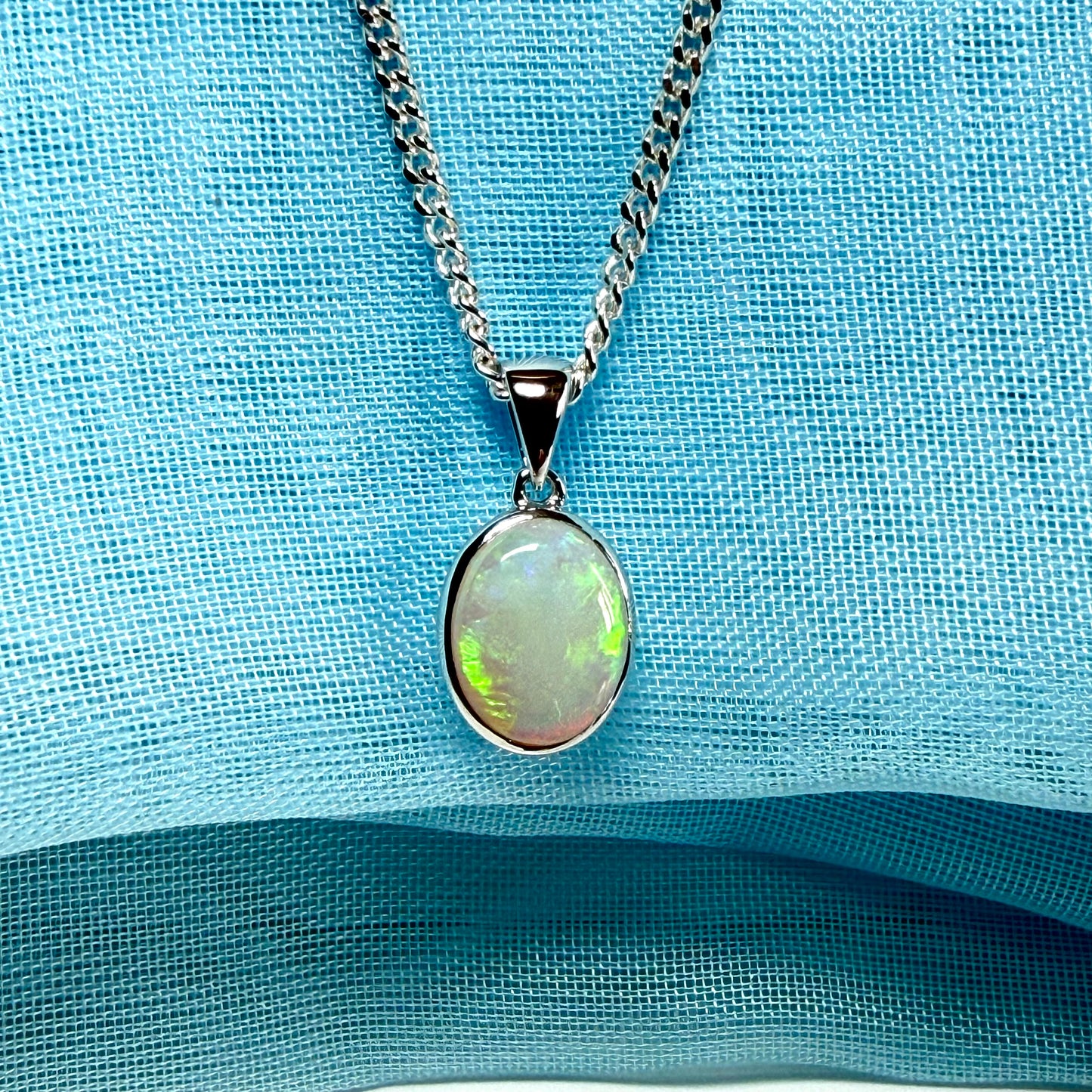 White gold real oval opal pendant rubbed over necklace with chain