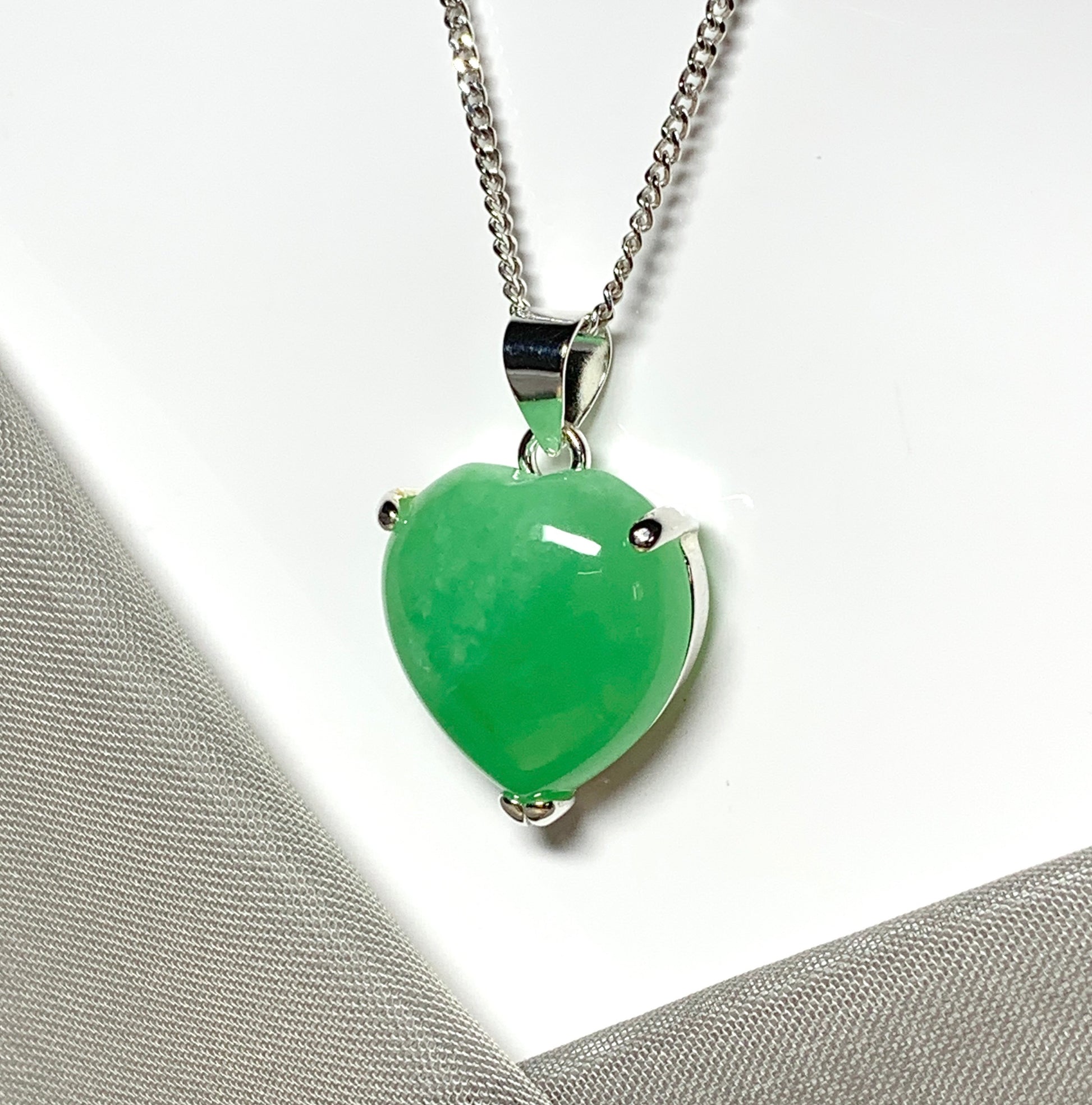 A beautiful and stunning real green jade necklace heart shaped sterling silver pendant