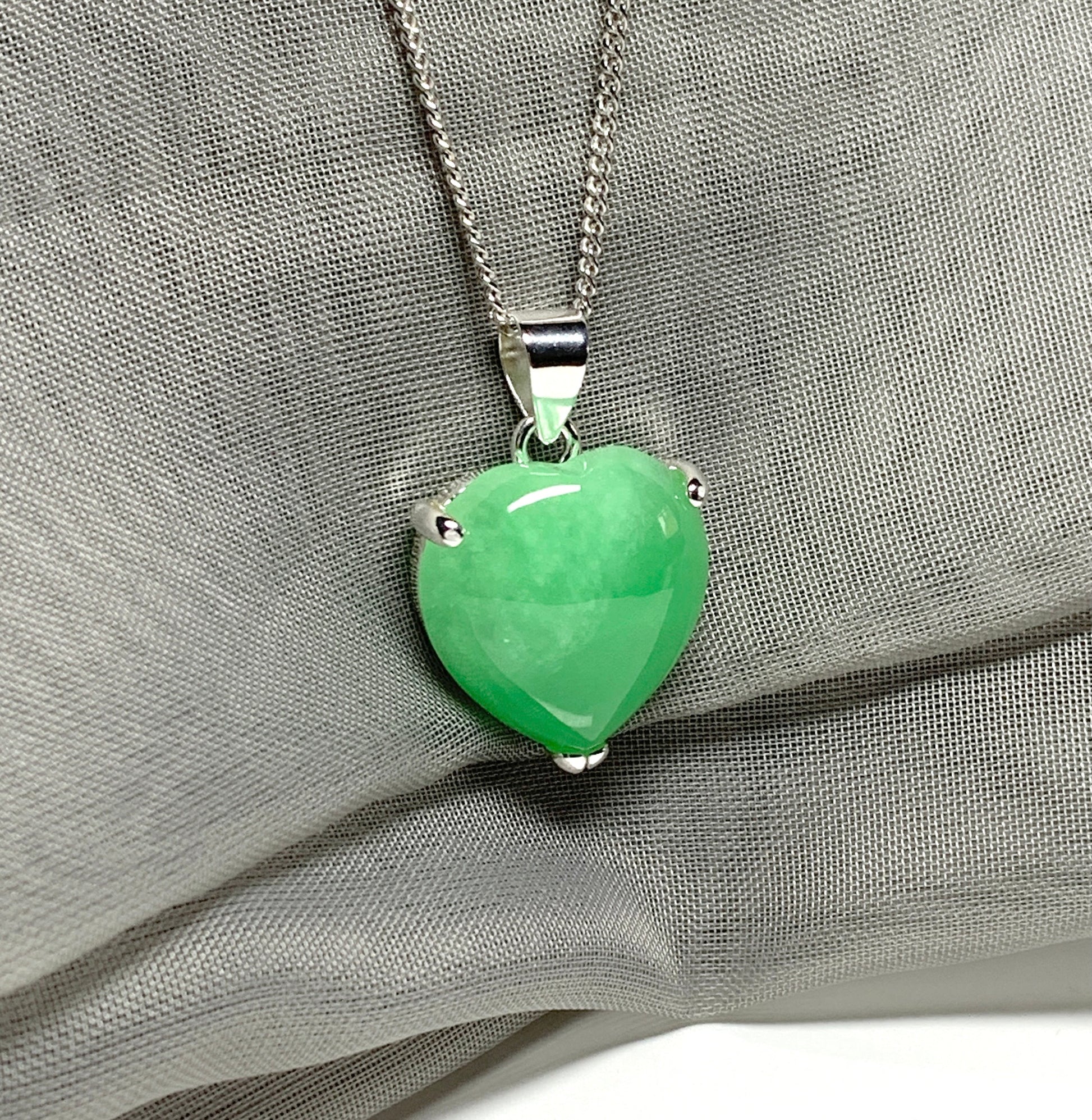 A beautiful and stunning real green jade necklace heart shaped sterling silver pendant