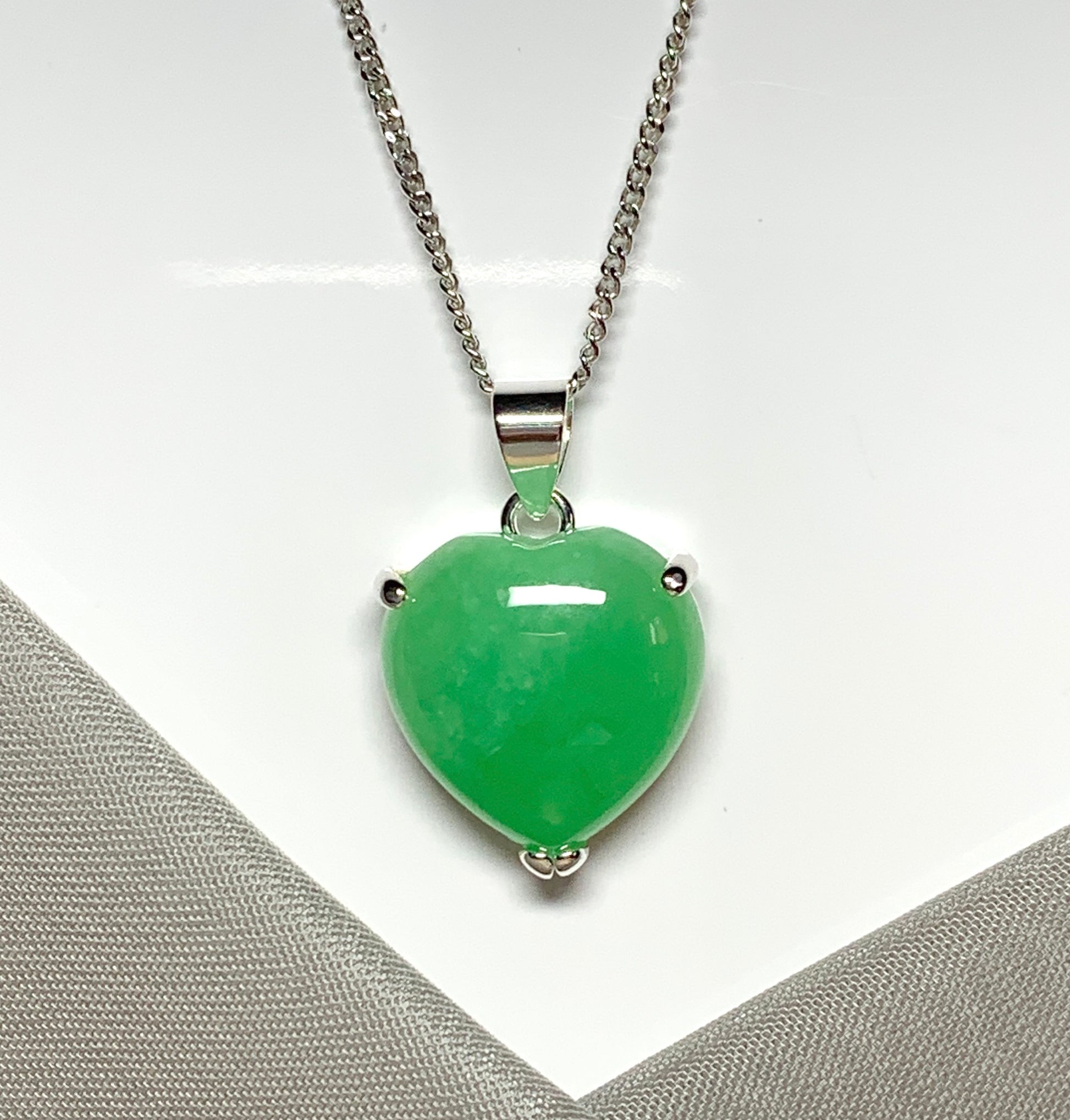 A beautiful and stunning real green jade necklace heart shaped sterling silver pendant