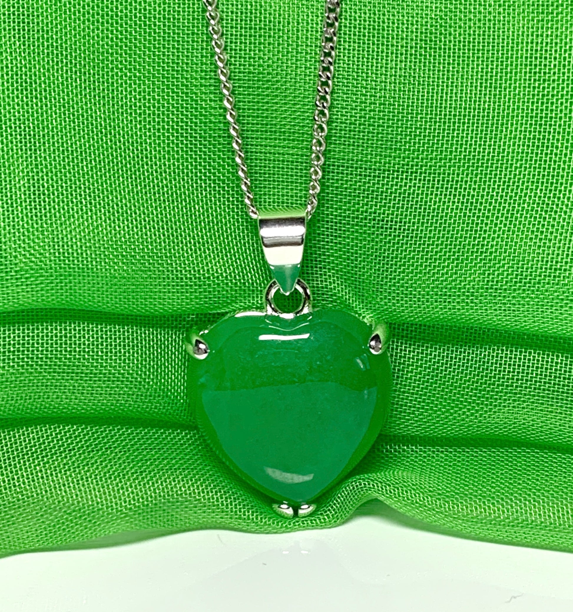 A beautiful real green jade necklace heart shape sterling silver pendant