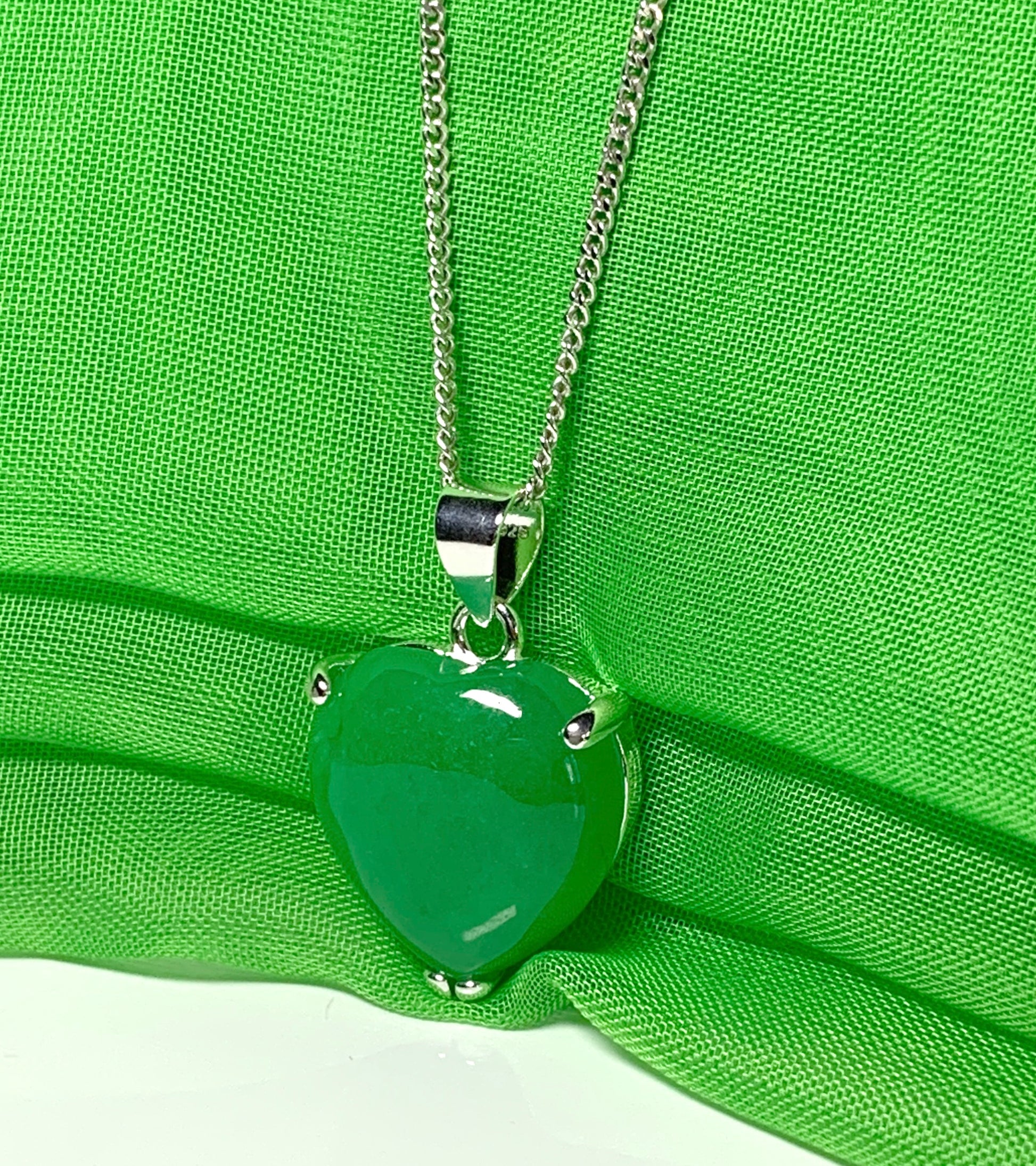 A beautiful real green jade necklace heart shape sterling silver pendant