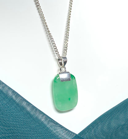 A cushion shaped silver real green jade necklace pendant