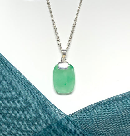 A cushion shaped silver real green jade necklace pendant