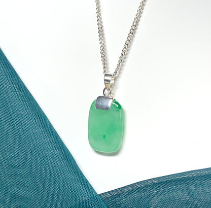 A cushion shaped silver real green jade necklace pendant