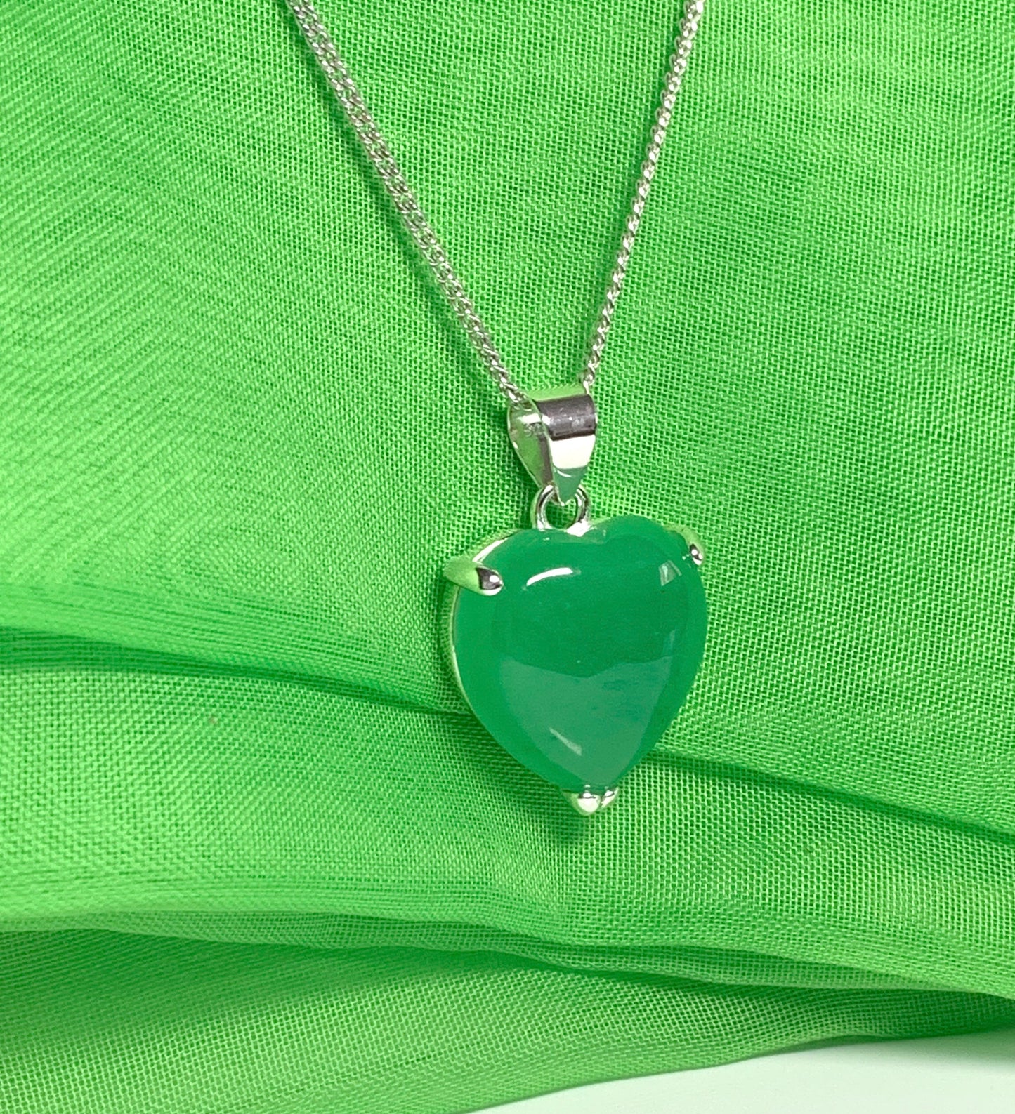 A gorgeous real green jade necklace heart shape sterling silver pendant