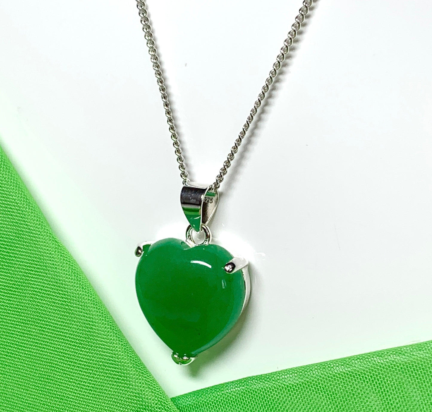 A gorgeous real green jade necklace heart shape sterling silver pendant