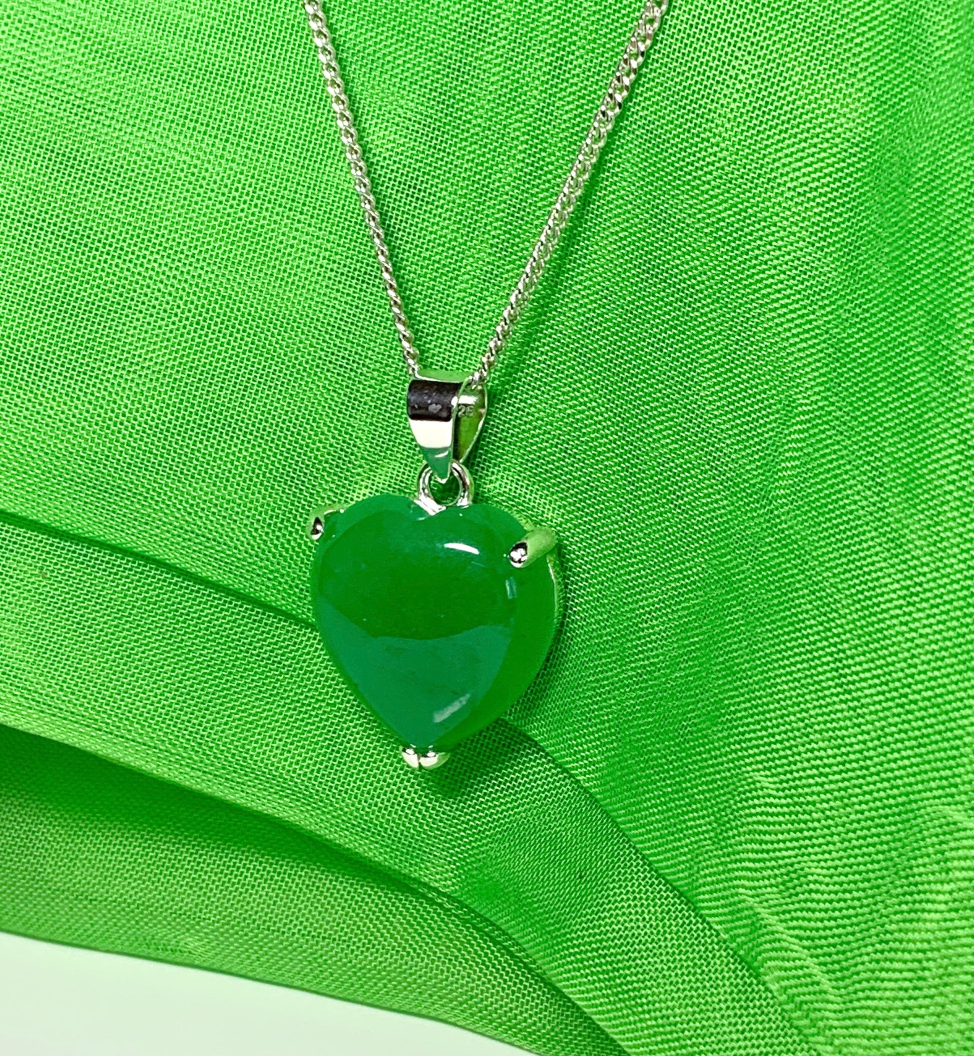 A gorgeous real green jade necklace heart shape sterling silver pendant