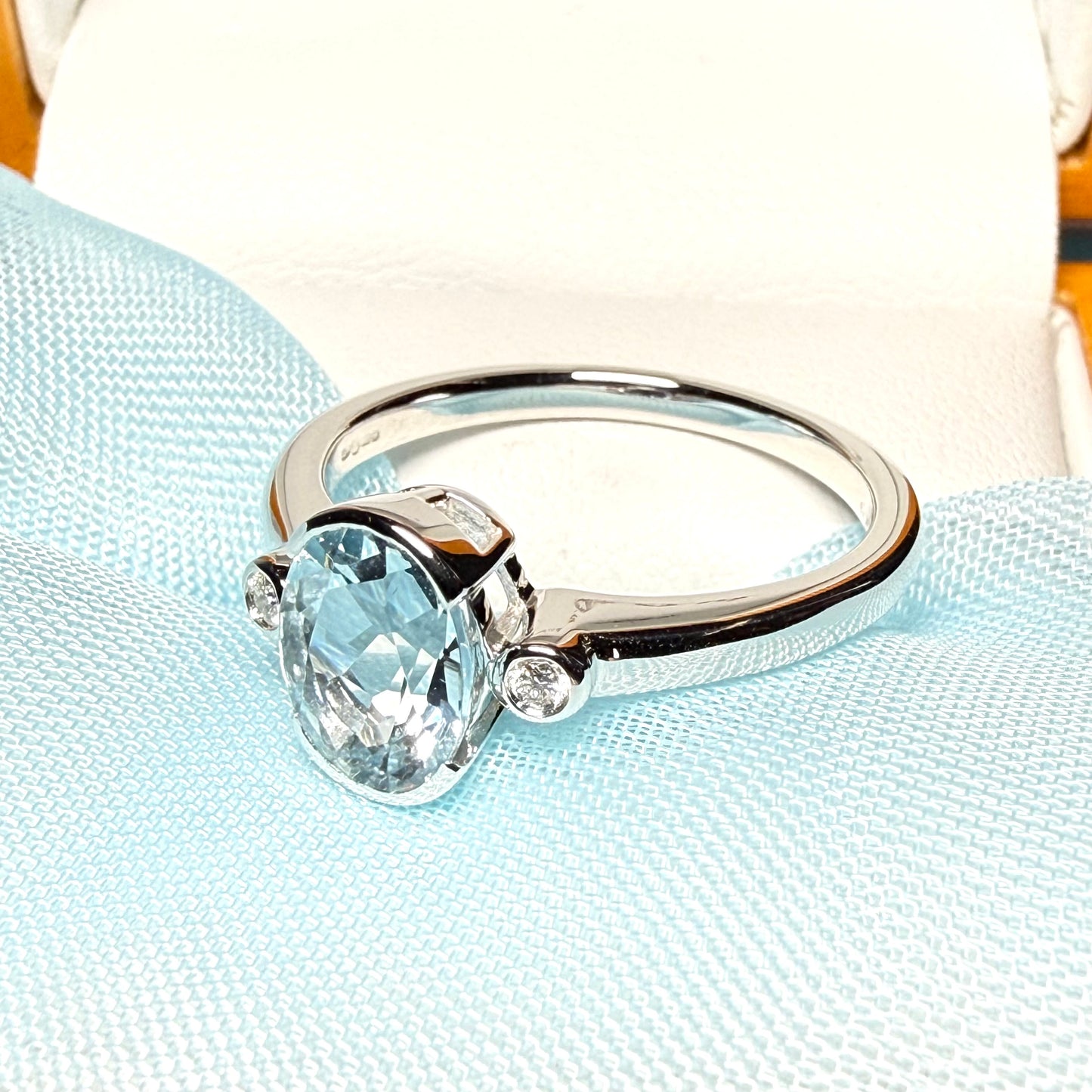 An oval real aquamarine ring and real round diamond white gold trilogy three stone dress, simply stunning