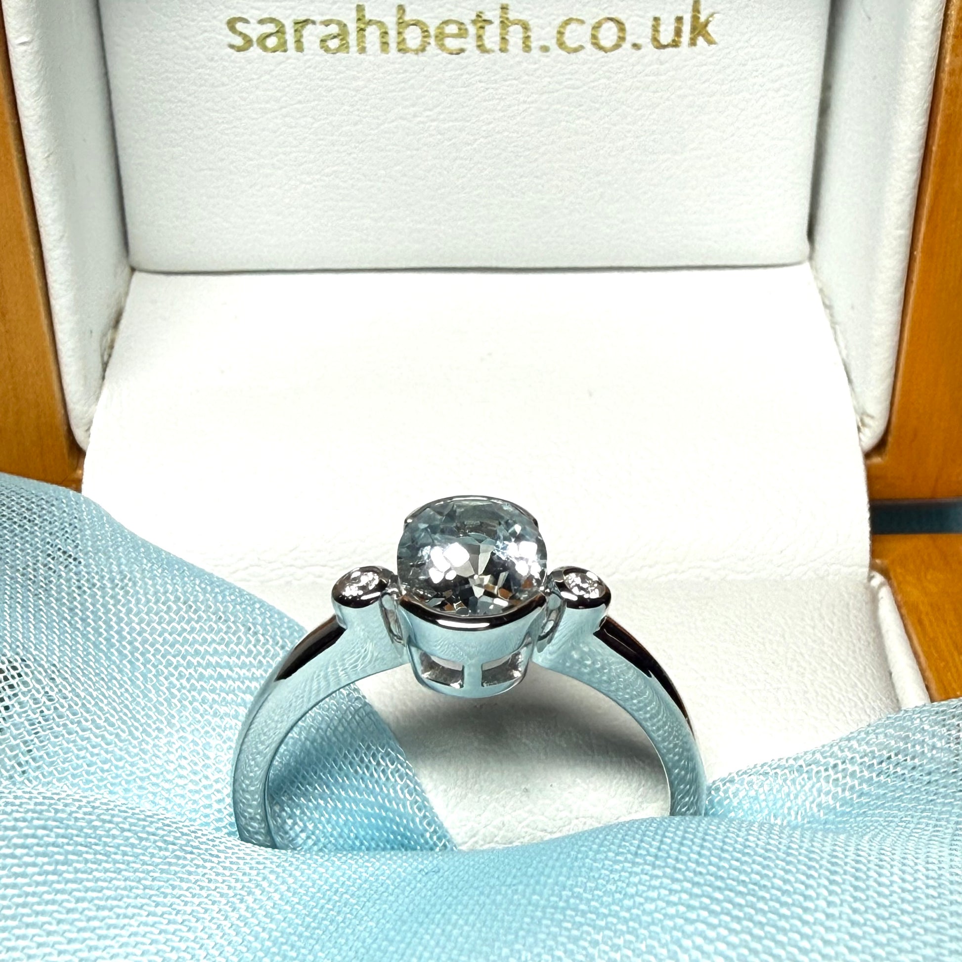 An oval real aquamarine ring and real round diamond white gold trilogy three stone dress, simply stunning