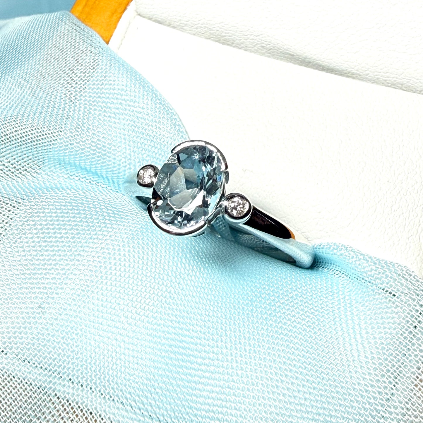 An oval real aquamarine ring and real round diamond white gold trilogy three stone dress, simply stunning