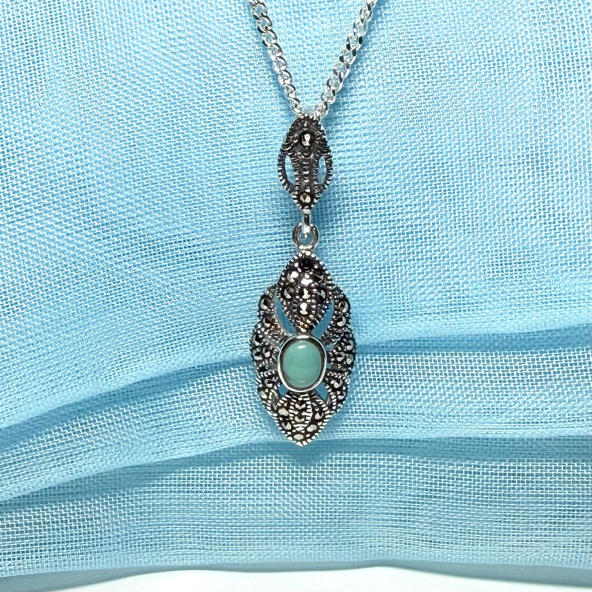 Oval turquoise and marcasite drop sterling silver necklace pendant