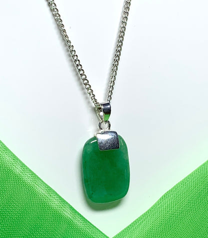 A necklace pendant having a real green jade sterling silver cushion shaped