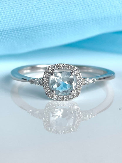 Real aquamarine ring and diamond white gold square cluster