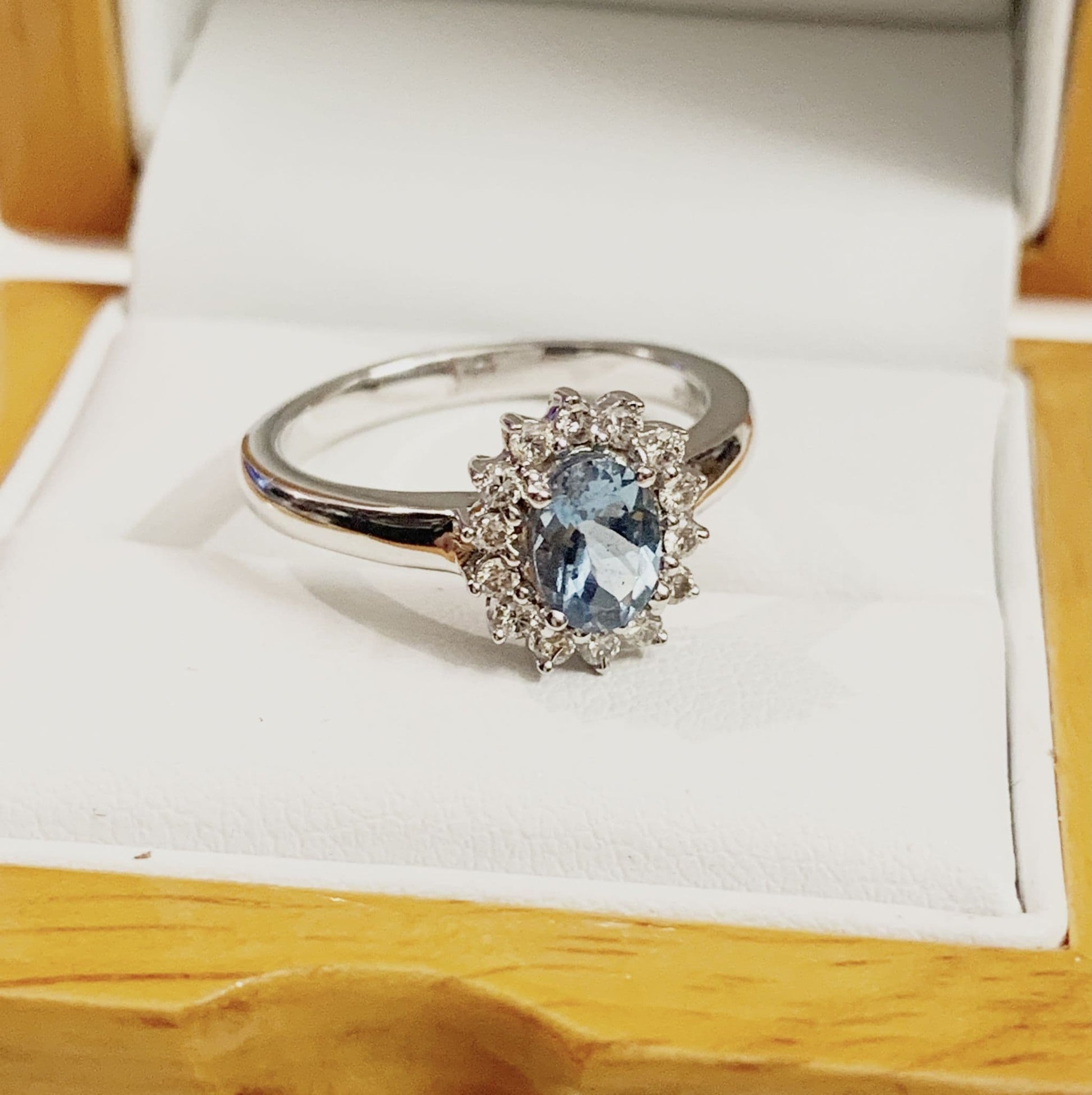 Aquamarine white gold oval and diamond cluster ring