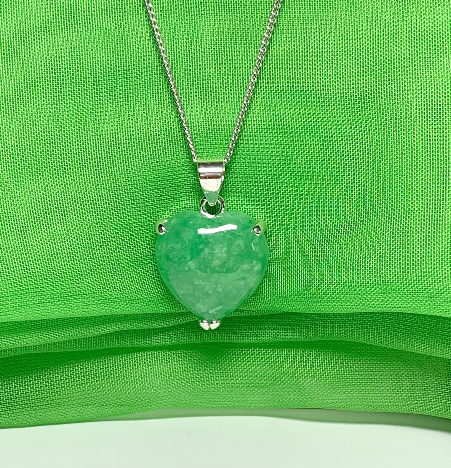 A real green jade necklace heart shape sterling silver pendant