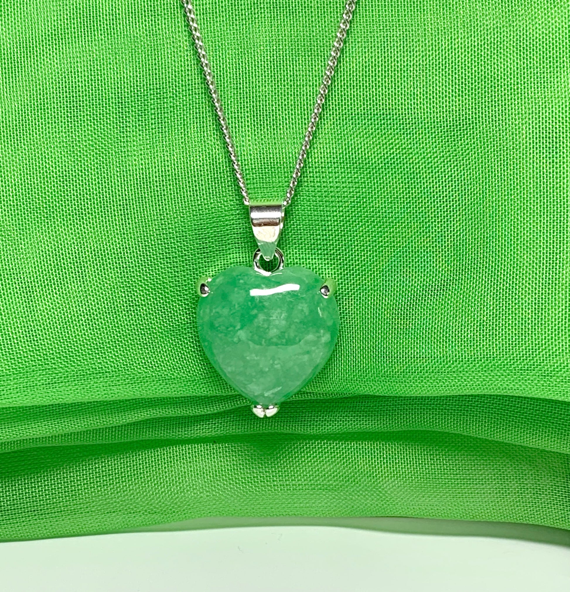 A real green jade necklace heart shape sterling silver pendant