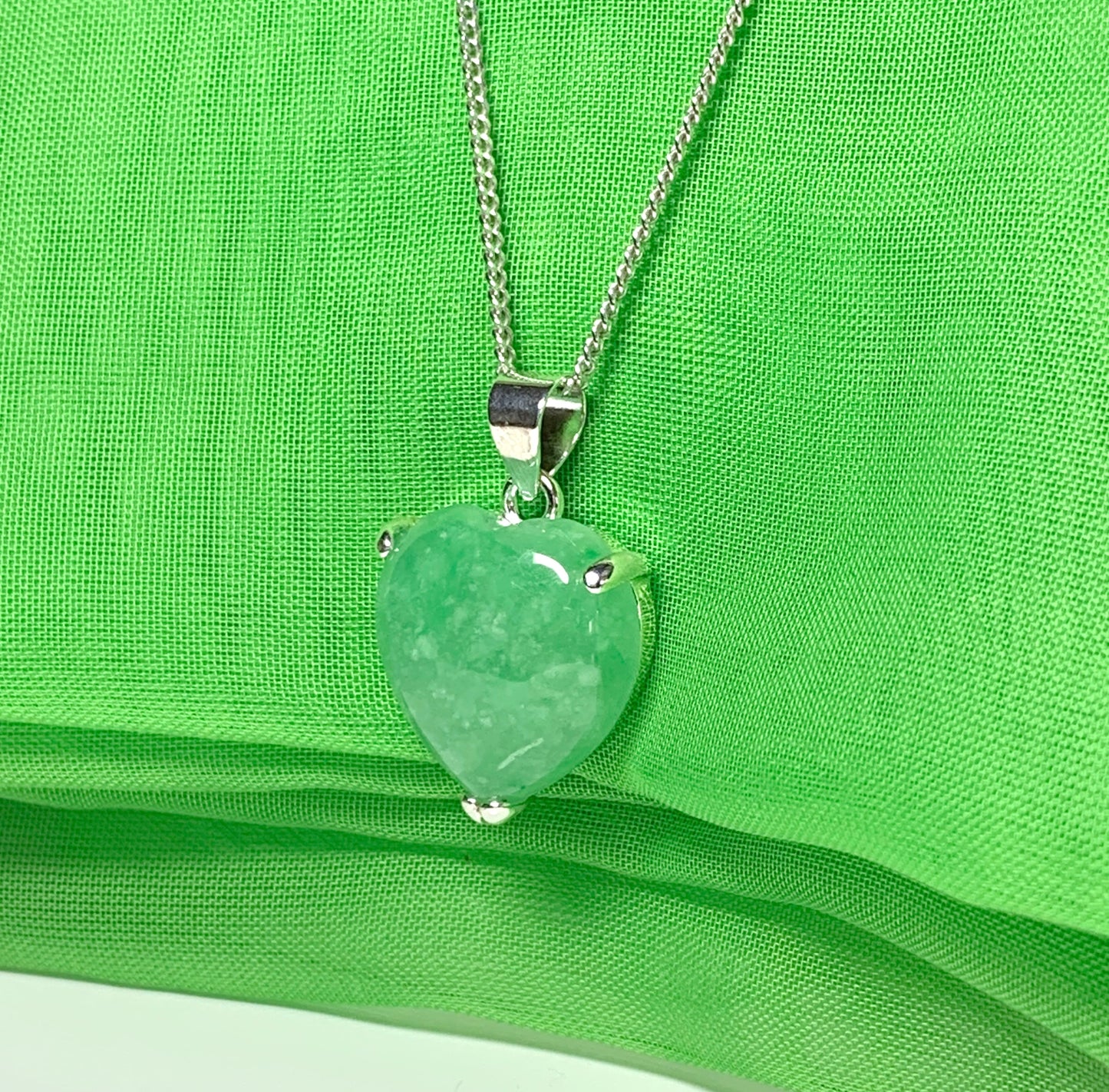 A real green jade necklace heart shape sterling silver pendant