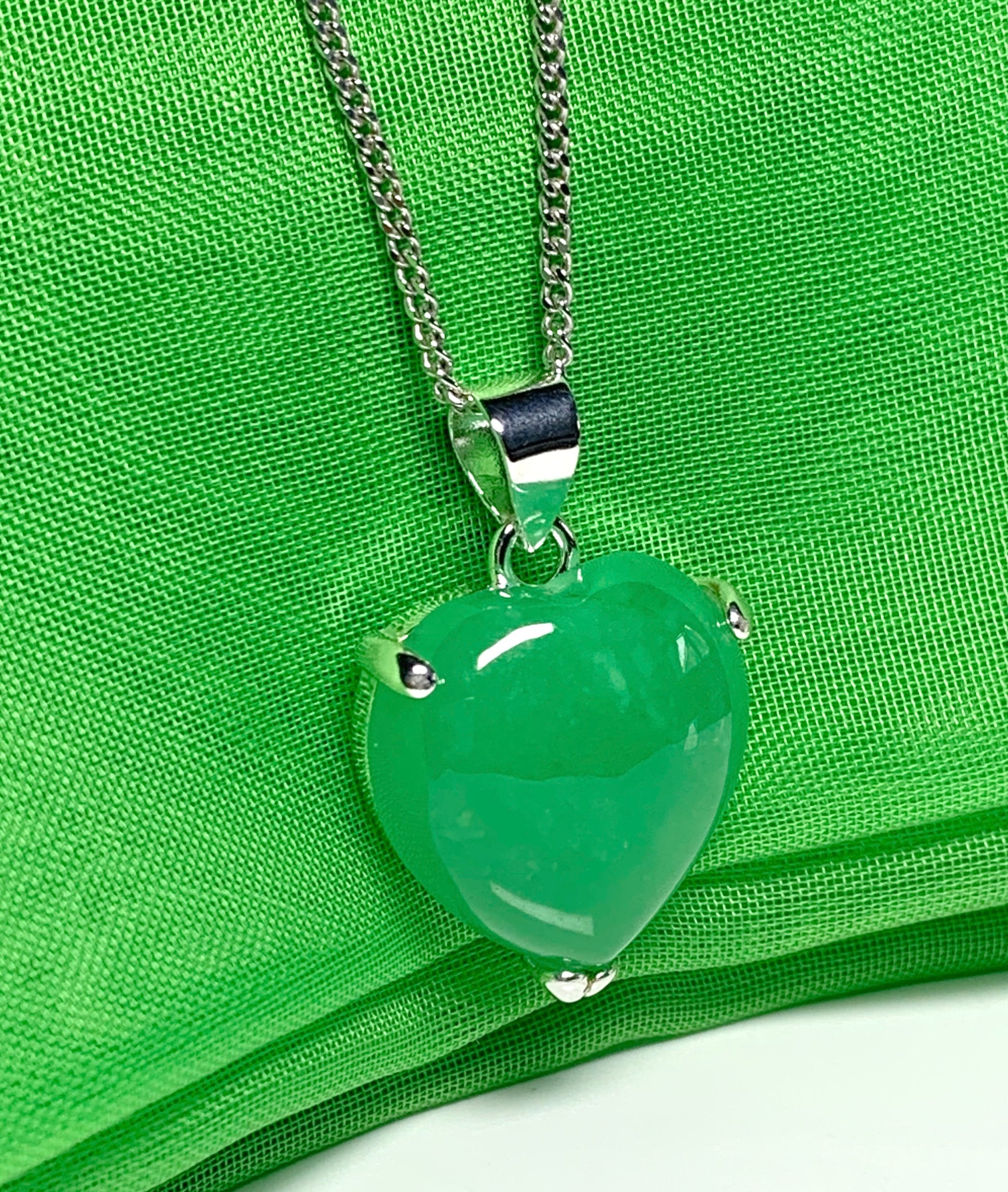 A real green jade necklace heart shape sterling silver pendant including chain