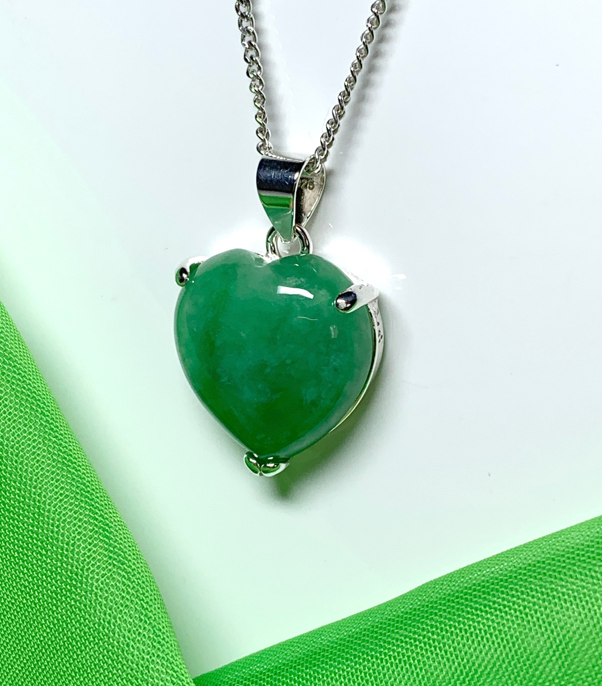 A real green jade necklace heart shape sterling silver pendant