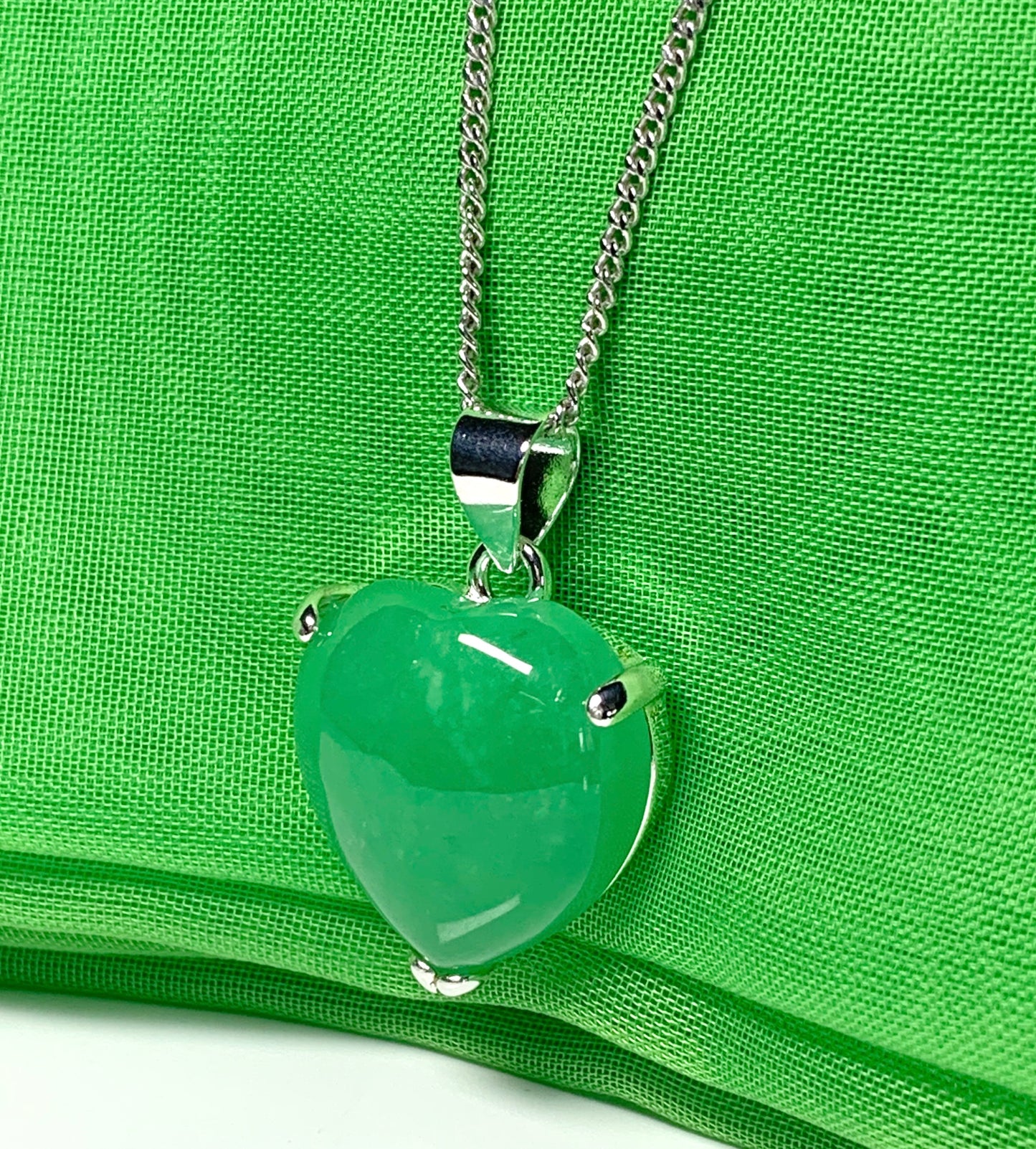 A real green jade necklace heart shape sterling silver pendant including chain