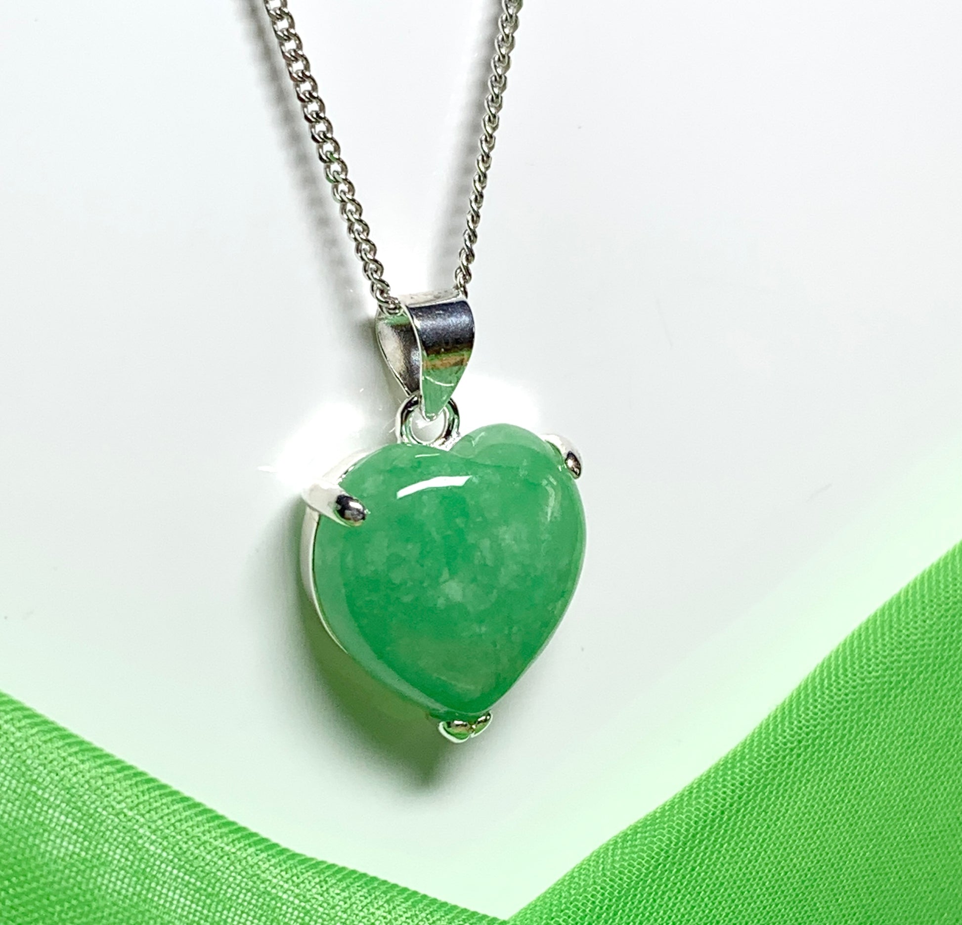 A real green jade necklace heart shape sterling silver pendant