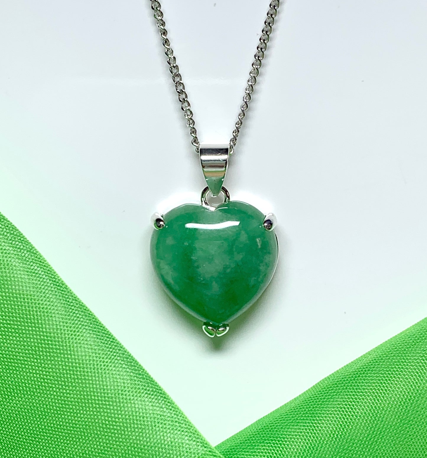 A real green jade necklace heart shape sterling silver pendant