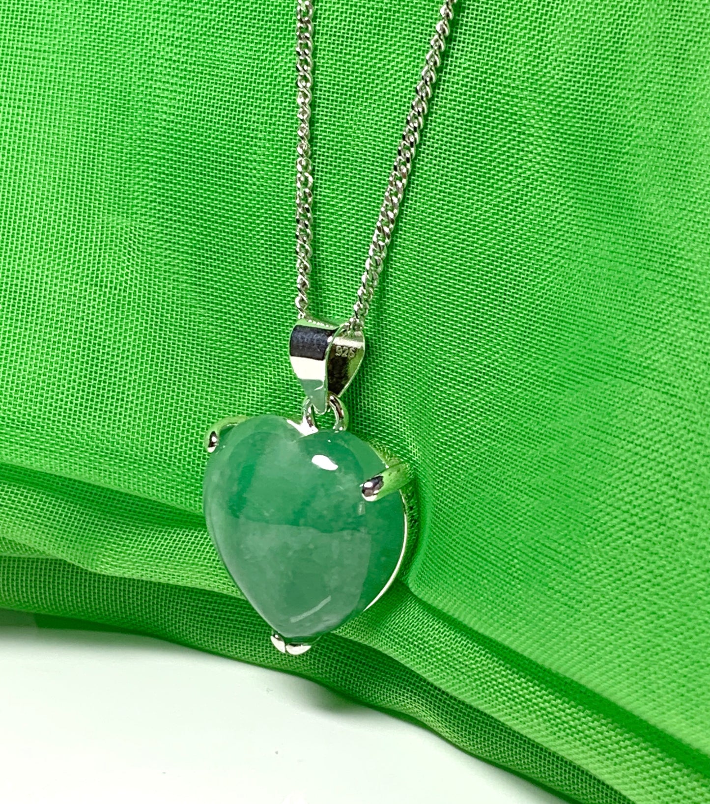 A real green jade necklace heart shape sterling silver pendant