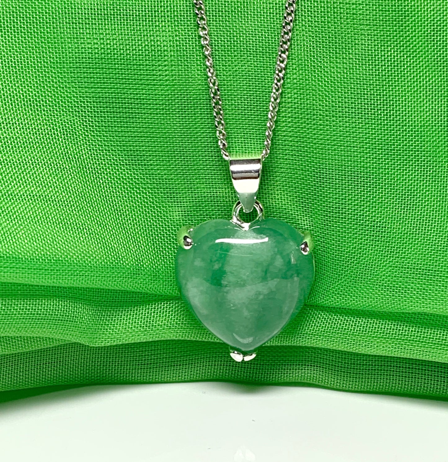 A real green jade necklace heart shape sterling silver pendant