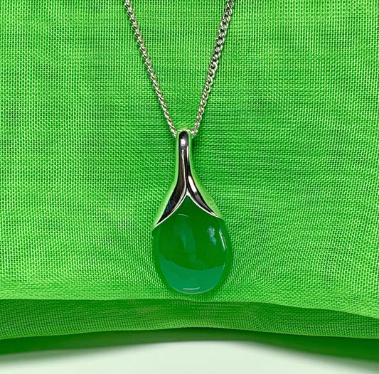 A real green jade necklace in a tear drop or pear shaped