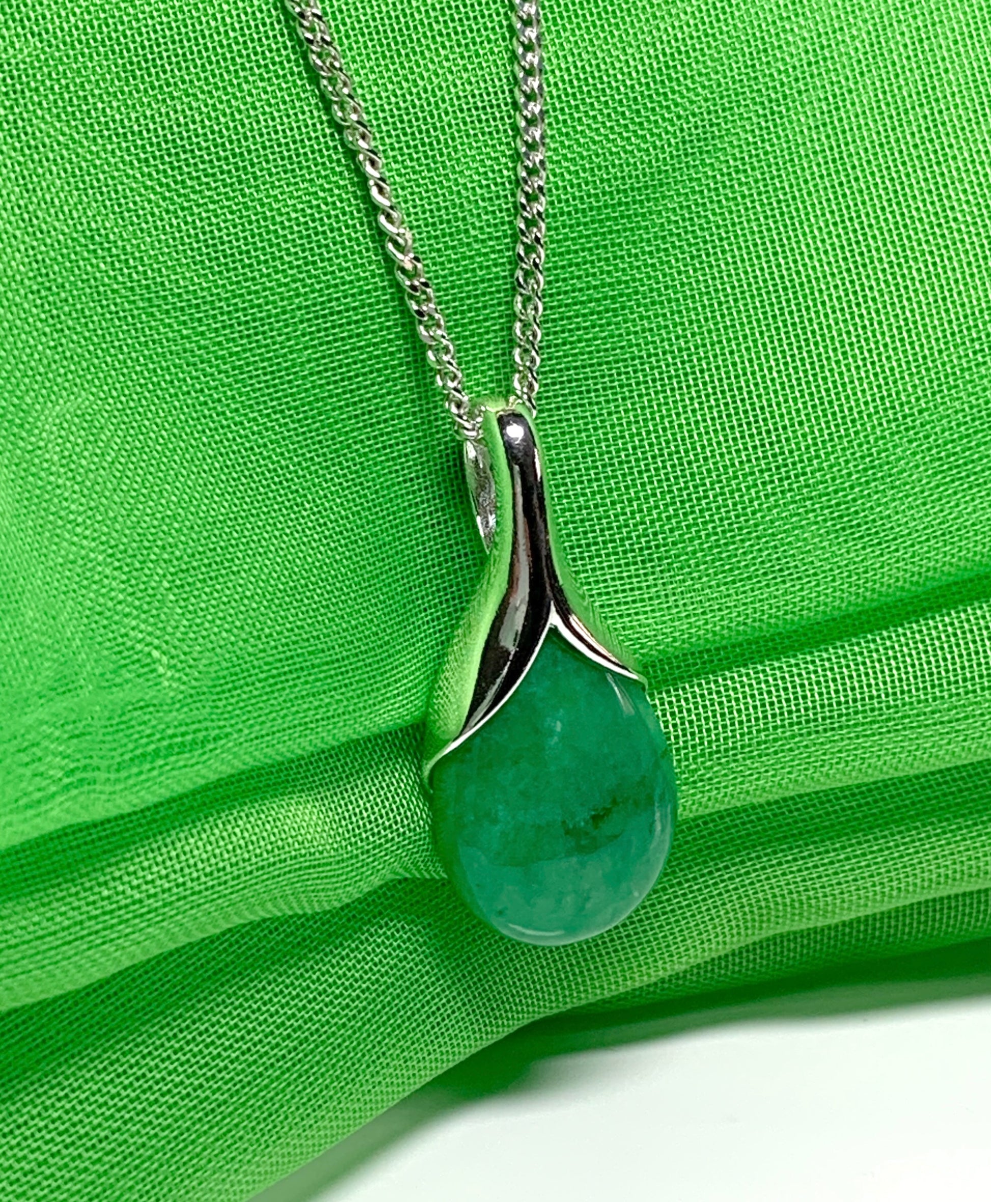 A real green jade necklace in a tear drop or pear shape pendant