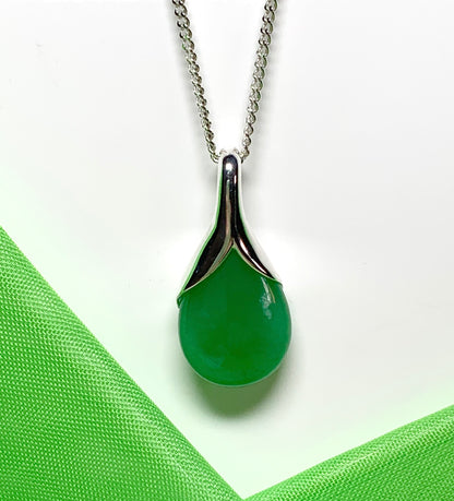 A real green jade necklace in a tear drop or pear shaped