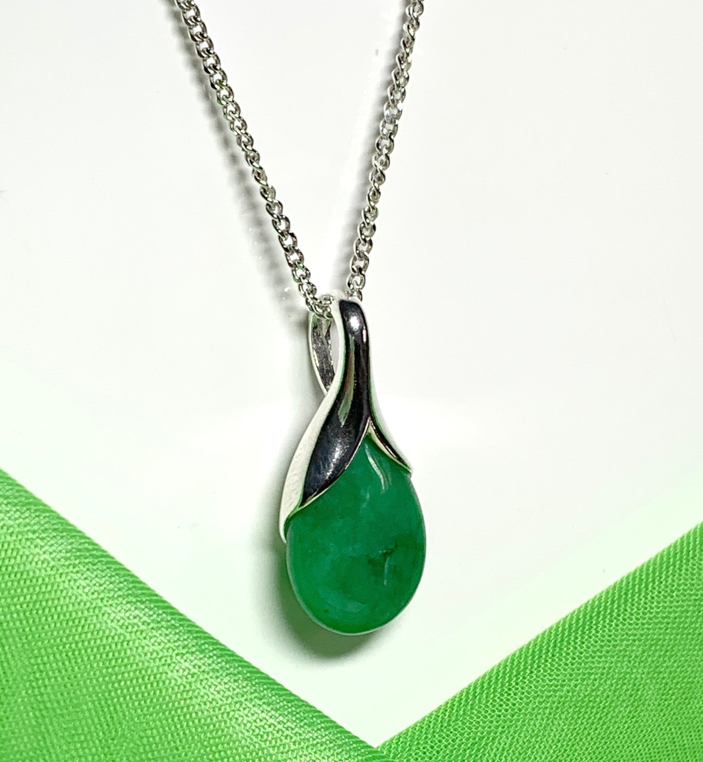 A real green jade necklace in a tear drop or pear shape pendant